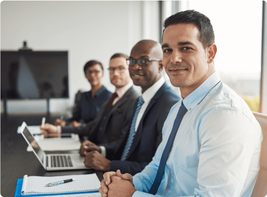 Executives sitting on a table Hero