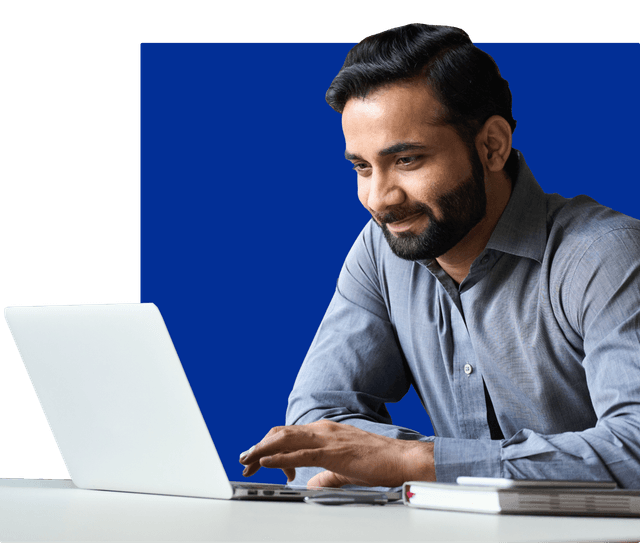 ZoniLive man using a laptop, accessing online learning resources for personal and professional development