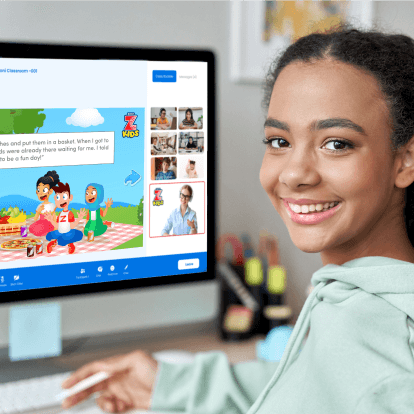 ZoniLive girl smiling while attending online English class on computer