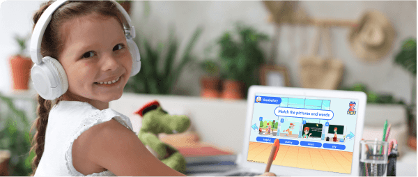 ZoniLive girl smiling during fun online English lesson on computer