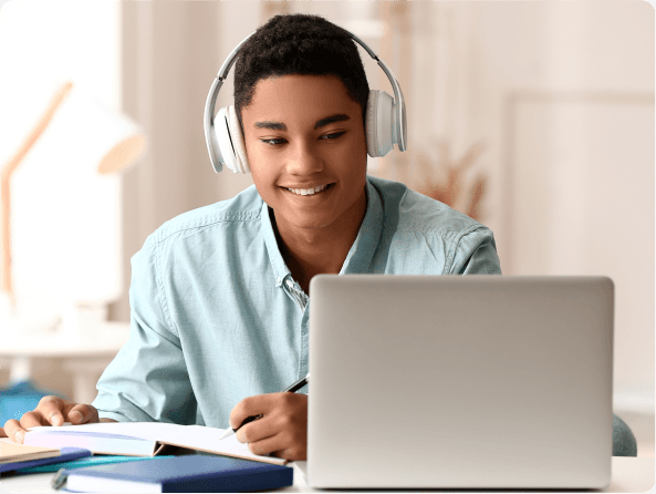 ZoniLive boy with a laptop, engaging in interactive online learning for educational growth